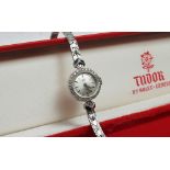 A Lady's 9ct white gold Tudor by Rolex wristwatch, the silvered dial with batons,