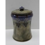 A Royal Doulton stoneware jar and cover, decorated with purple flowerheads to a blue band,