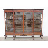 An impressive George III style mahogany breakfront bookcase,
