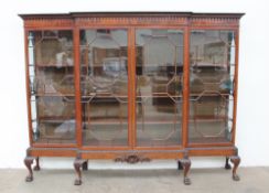 An impressive George III style mahogany breakfront bookcase,