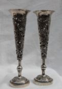 A pair of Chinese white metal bud vases,