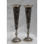 A pair of Chinese white metal bud vases,