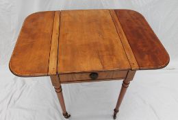 A 19th century mahogany pembroke / games table, the rectangular top with drop flaps,