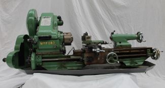 A Myford Super 7 lathe, serial number SK1444884 in green with additional gears, chucks,