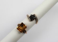 A yellow sapphire ring the rectangular faceted stone claw set to a 9ct yellow gold setting and