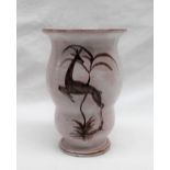 A Gmundner Werkstatte studio pottery vase with a pinky cream glaze decorated with a leaping deer,