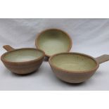 A pair of Winchcombe pottery single handled bowls, in an oatmeal palette,