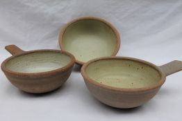 A pair of Winchcombe pottery single handled bowls, in an oatmeal palette,