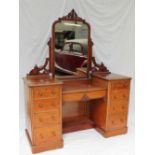 A Victorian mahogany dressing table, the central mirror with a pierced cresting rail,