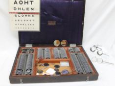 A Theodore Hamblin optometry set, with various lenses, contained in a case,