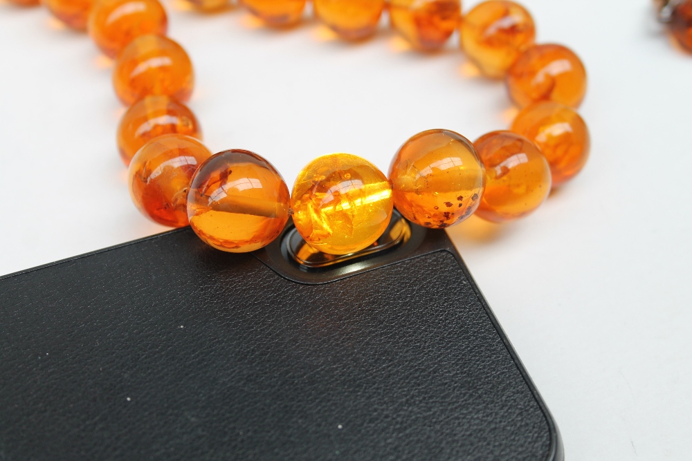 An amber bead necklace with spherical beads together with an expanding bracelet a rotating fob seal - Image 4 of 7