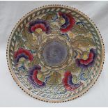 A Crown Ducal, Charlotte Rhead pottery charger decorated with purple,