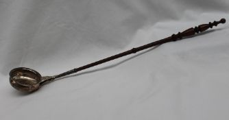 A Victorian silver ladle with a turned fruitwood handle, Birmingham, 1871, 44.