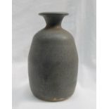 A studio pottery vase, with a mottled blue green ground, impressed with initials and "TUGWMMWD",
