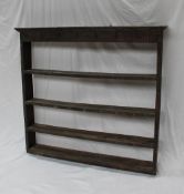 A 19th century oak fronted and pine dresser open rack, the moulded cornice and four shelves,