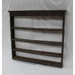 A 19th century oak fronted and pine dresser open rack, the moulded cornice and four shelves,