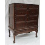 A 17th century style oak chest on stand, the oak planked top above two short,