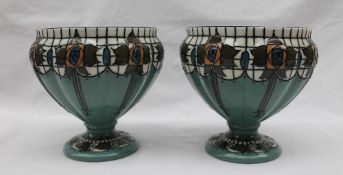 A pair of Wood & Sons, Burslem Trellis pattern pedestal vases, with a white border and green ground,