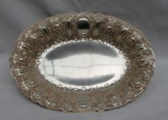 A Victorian Scottish silver dish of oval form, decorated with masks, scrolls and leaves, Glasgow,