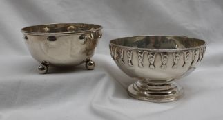 A Victorian silver sugar basin of circular form, with bell flower drops on a spreading foot, London,