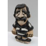 A John Hughes pottery Grogg depicting a player in Pontypridd R.F.C. kit with red No.