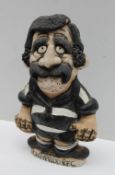 A John Hughes pottery Grogg depicting a player in Pontypridd R.F.C. kit with red No.