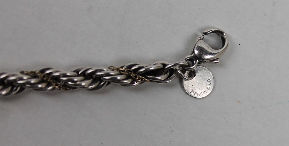 A Tiffany & Co. silver and 18ct yellow gold rope twist bracelet, approximately 13. - Image 4 of 5