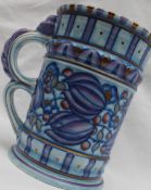 A Crown Ducal pottery handled vase decorated with purple,
