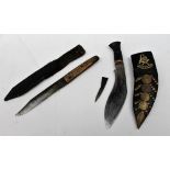 A souvenir Kukri knife with curved blade and leather scabbard inset with brass Nepal badge,