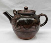 Ray Finch - a large studio pottery teapot, with a graded brown ground with scrolling decoration,