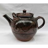 Ray Finch - a large studio pottery teapot, with a graded brown ground with scrolling decoration,