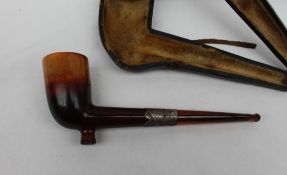 A Meerschaum pipe, with a silver collar and amber mouth piece,