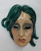 An Essevi pottery wall mask, depicting a pouting lady with flowing green hair, marked "Essevi,