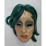 An Essevi pottery wall mask, depicting a pouting lady with flowing green hair, marked "Essevi,