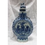 A Chinese blue and white porcelain moonflask, the domed finial with a dog of foo terminal,