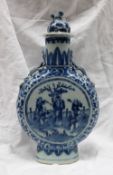 A Chinese blue and white porcelain moonflask, the domed finial with a dog of foo terminal,