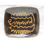 A large slipware decorated dish,