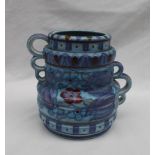 A Crown Ducal, Charlotte Rhead pottery twin handled vase decorated with purple,