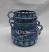 A Crown Ducal, Charlotte Rhead pottery twin handled vase decorated with purple,