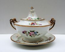 A Swansea porcelain sauce tureen, cover and stand, locally decorated with sprays of garden flowers,