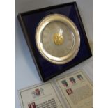 Danbury Mint - A silver commemorative plate authorised by the College of Arms on the occasion of