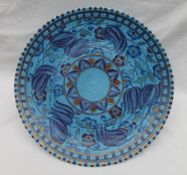 A Crown Ducal, Charlotte Rhead pottery charger decorated with purple,