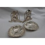 A pair of Elizabeth II silver heart shaped dishes, embossed with scrolls and leaves, Sheffield,