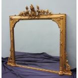 A 19th century gilt gesso overmantle mirror with a floral and leaf cresting,