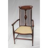 An Art Nouveau mahogany elbow chair,