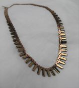 A two tone 9ct yellow gold fringe necklace, with rectangular links, 42cm long, approximately 27.