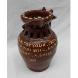 An early 20th century studio pottery puzzle jug,