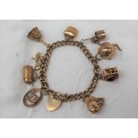A 9ct yellow gold bracelet set with numerous charms including Capricorn, stein, anchor, heart,