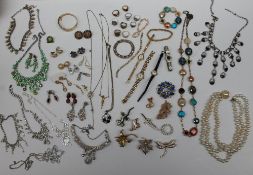 Assorted costume jewellery including faux pearls, brooches,