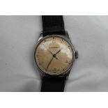 A Gentleman's Longines wristwatch, the champagne dial with Arabic numerals on a leather strap,